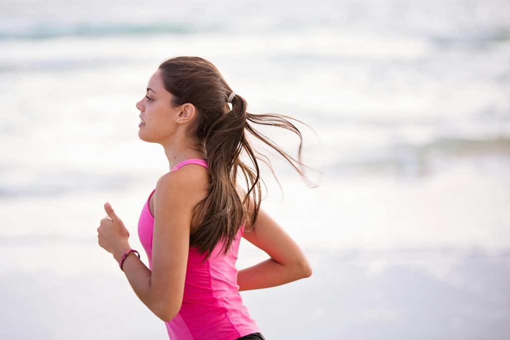 woman running on the beach