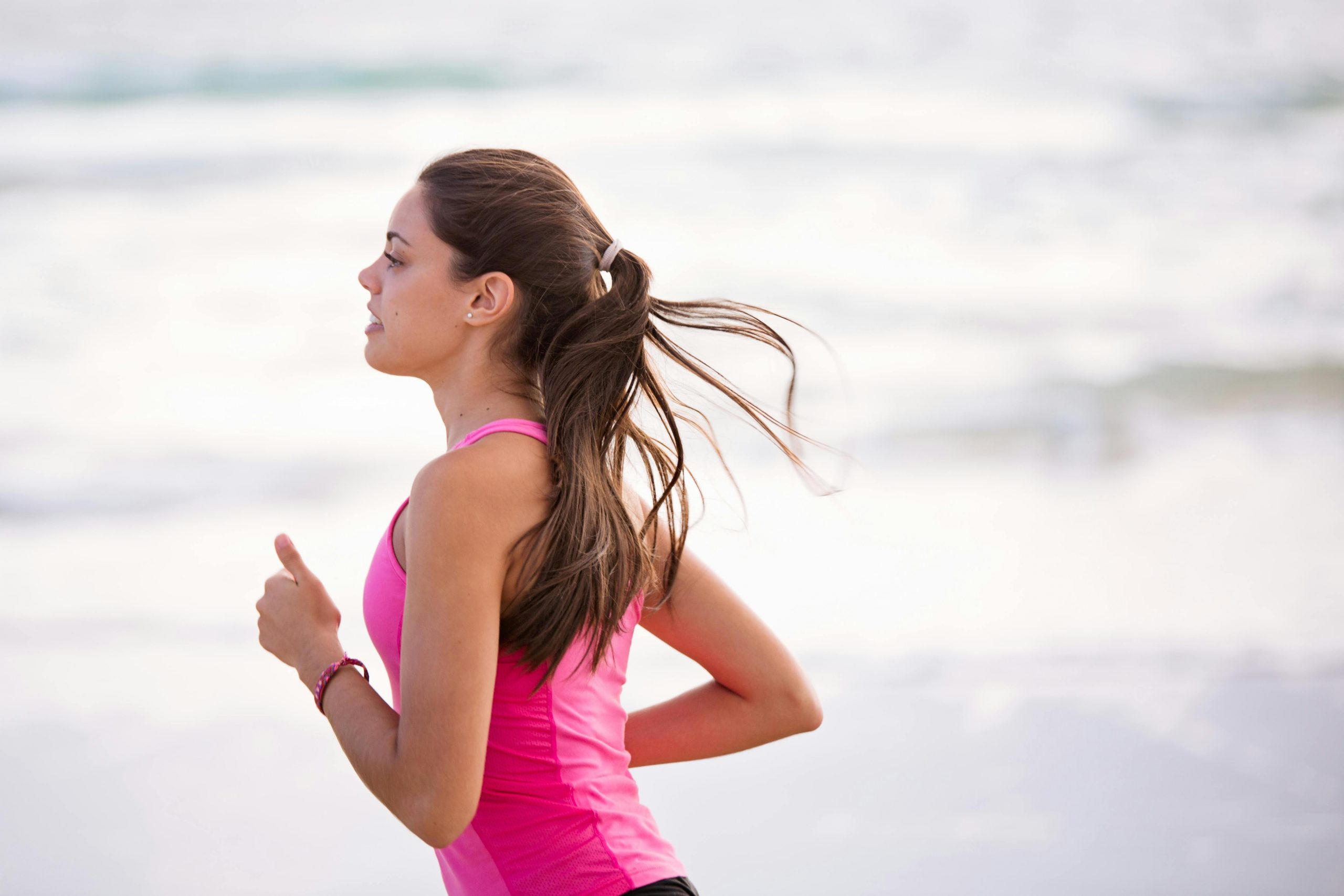 woman running on the beach
